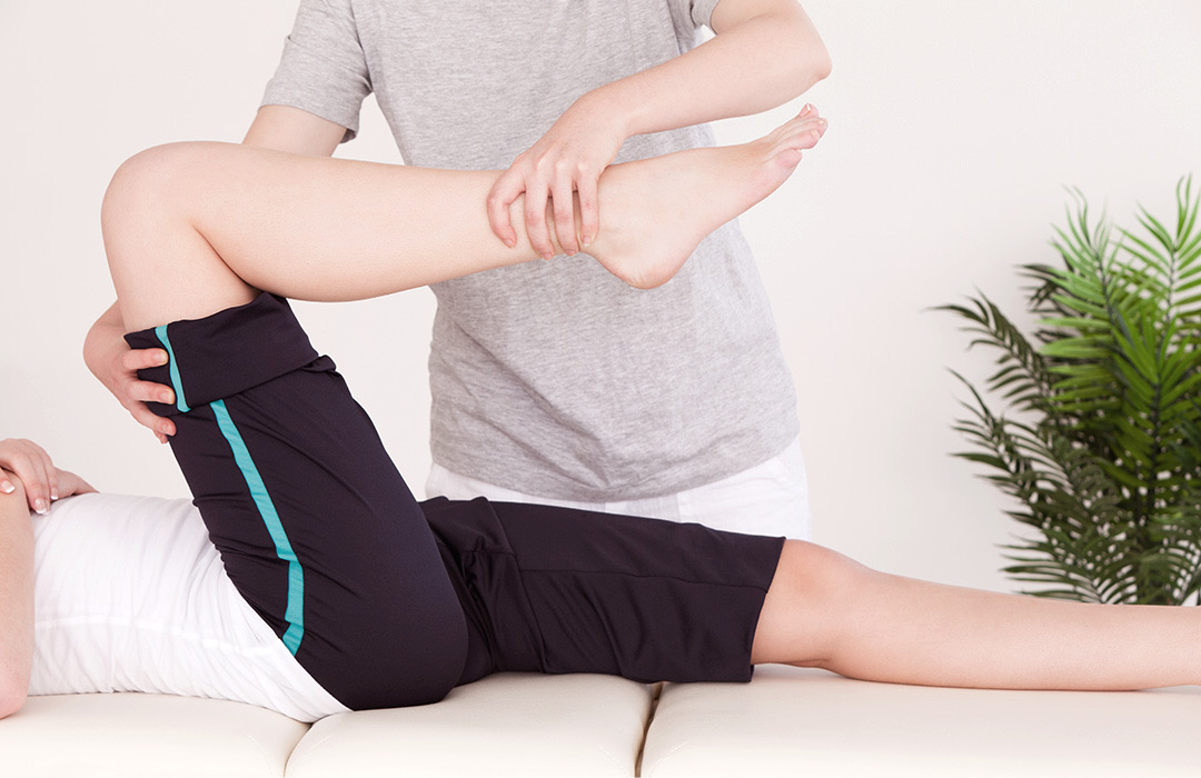 A registered massage therapist treating a client