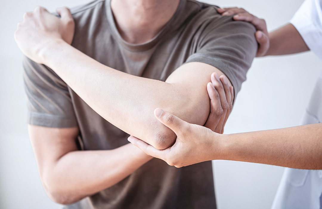 Therapist working on a client's shoulder